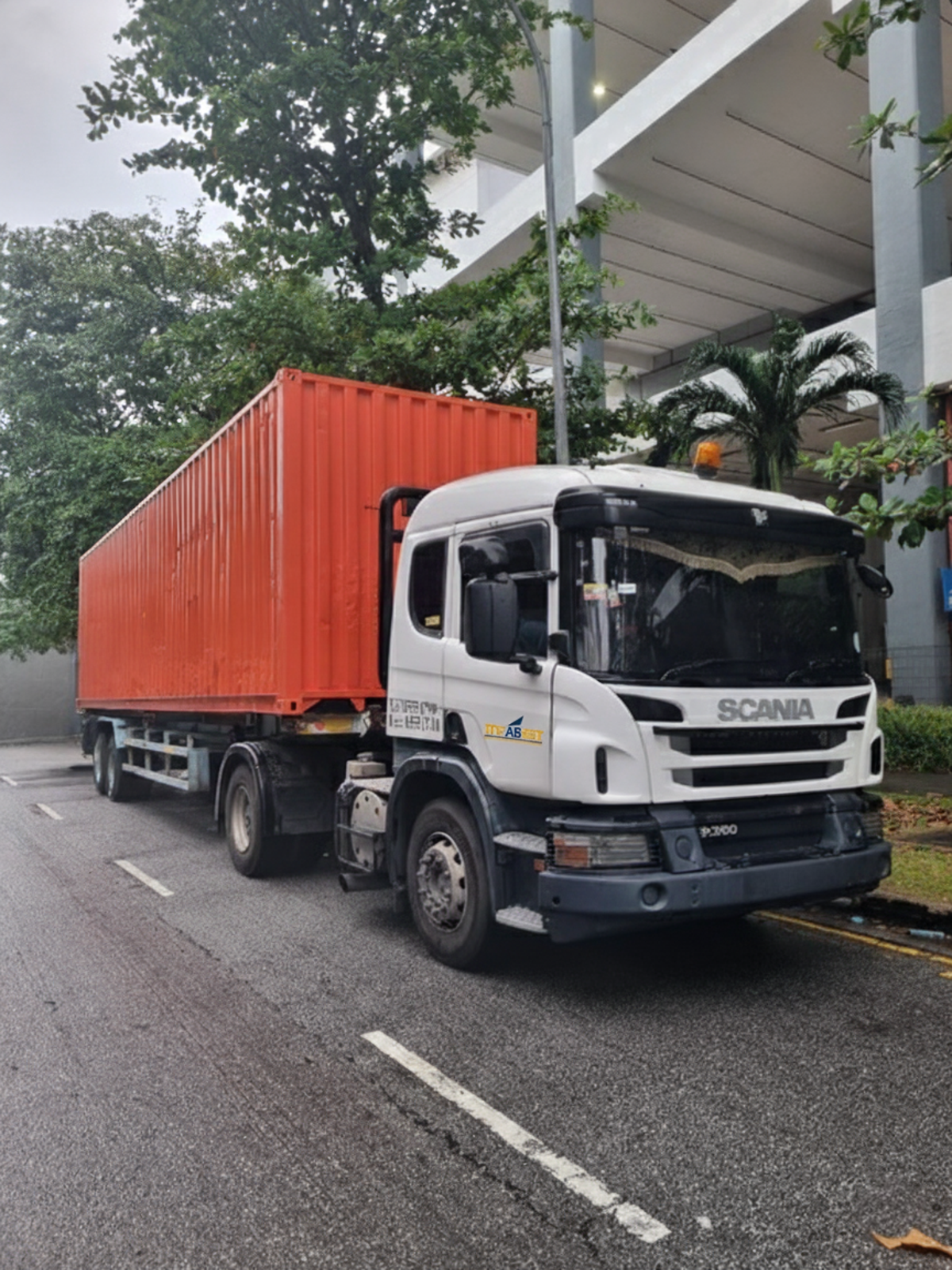 Home Infabest Logistics Scania truck transporting container in Singapore